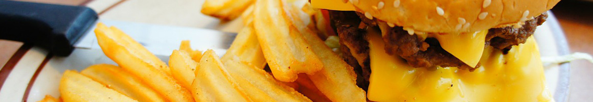 Eating American (Traditional) Burger at Grumps Burgers restaurant in Burleson, TX.